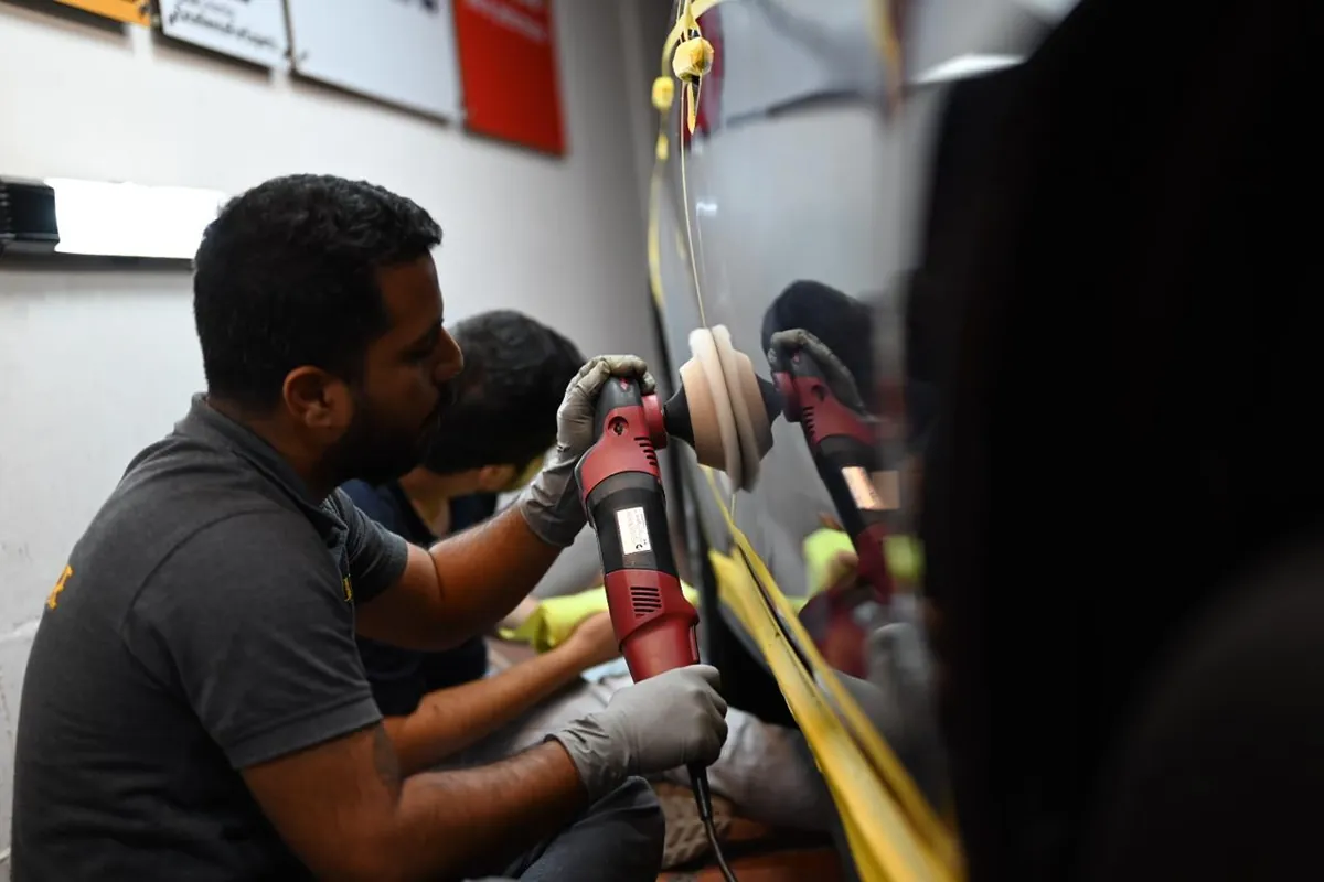 Machine paint correction on a vehicle panel