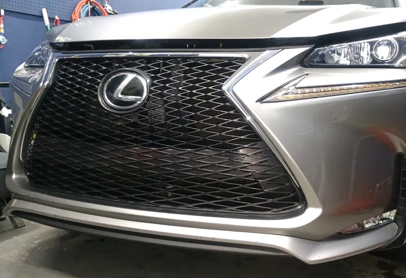 Detailed front grille and paint on a Lexus