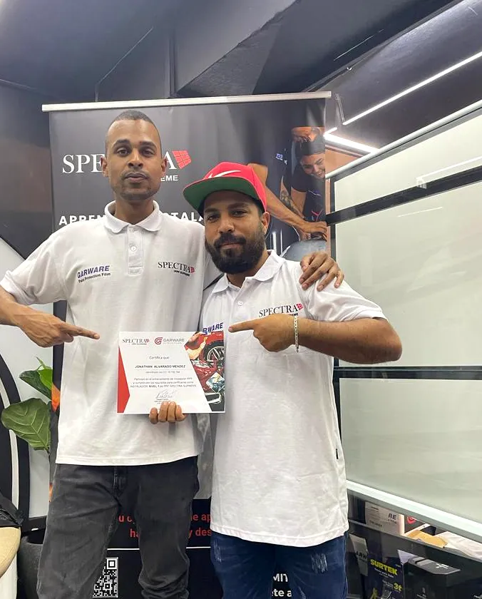Founder receiving his Spectra Supreme paint protection film (PPF) installation certification
